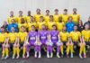 FC Emmenbrücke: Es kann ja nur noch besser werden Group portrait of a soccer team in yellow and black kits, with four goalkeepers in purple jerseys seated in front row.