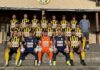 Vorschau FC Gunzwil: Jugend forscht bei den Michelsämtern Group photo of a soccer team in yellow and black striped jerseys, with two goalkeepers in blue and orange in the front row.