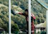 FCL: Jérôme Bieler unterschreibt Profivertrag Soccer goalkeeper in a maroon kit and gloves stands behind a goal, one gloved arm extended as she points toward the field.